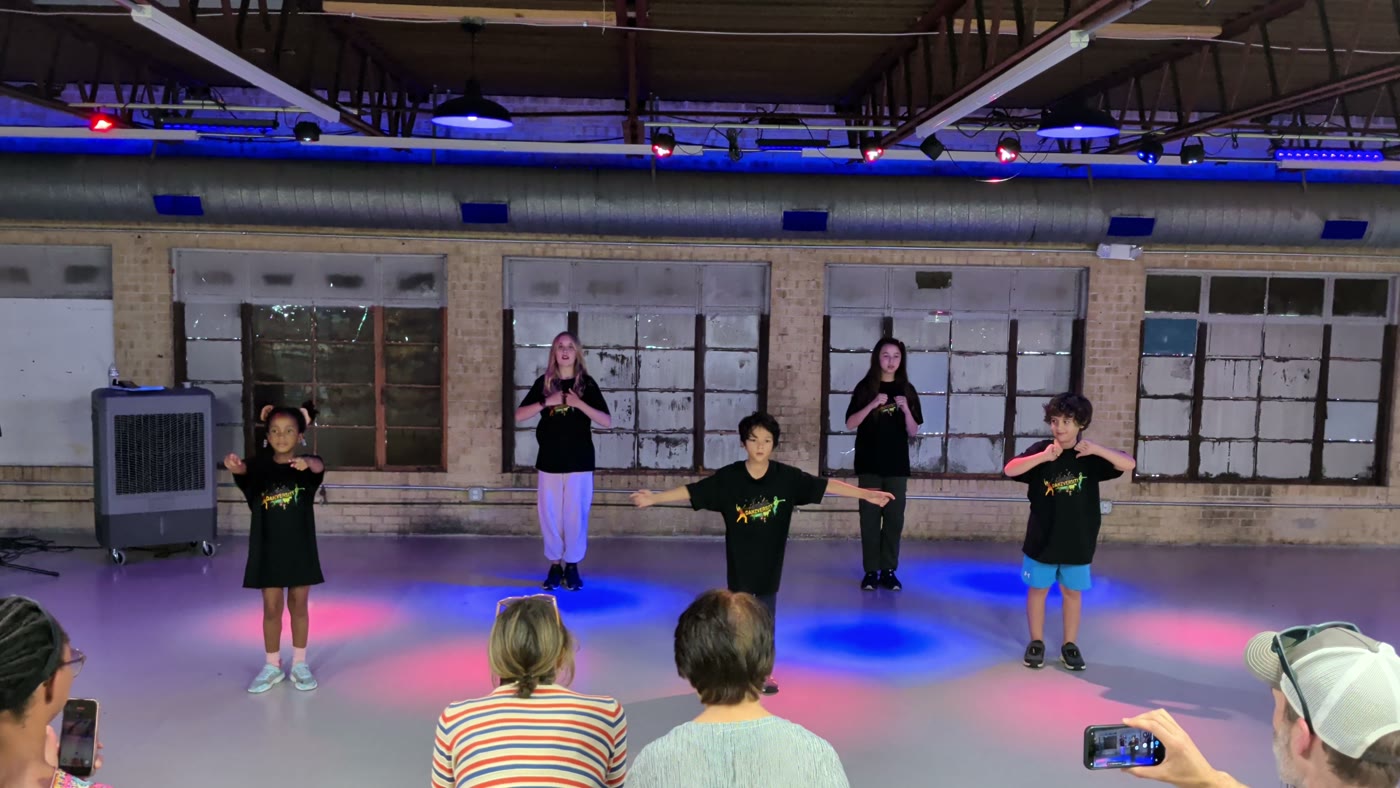 Camp showcase at Danzversity with families watching
