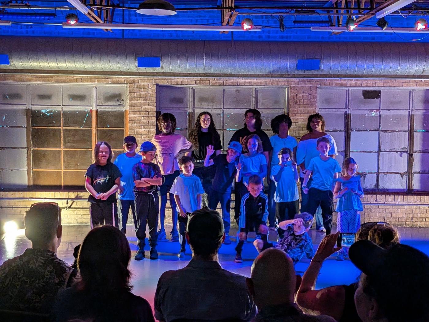 Crew facing the audience at the end of their piece